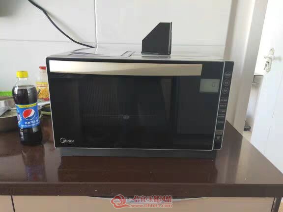 ����΢��¯�ų��£�ֻ���˼��Σ���Ƶ�������������ܶ࣬һǧ�����������ģ�700Ԫ�����а�װ��˵����
